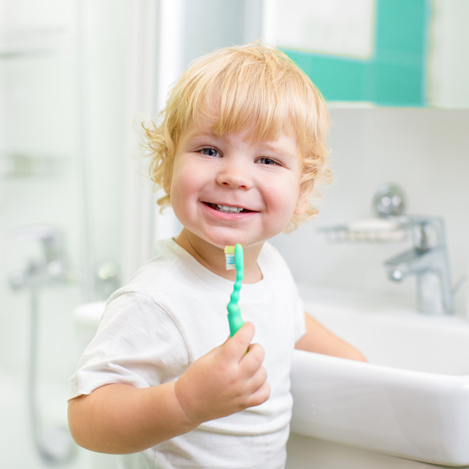 photodune-5608409-happy-kid-or-child-brushing-teeth-in-bathroom-dental-hygiene-s1